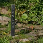 Hand-carved word "HRAGRA" on slate pillar