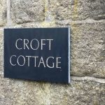house sign carved in slate with gold leaf lettering