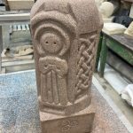 Celtic triple goddess, carved on a red sandstone pillar